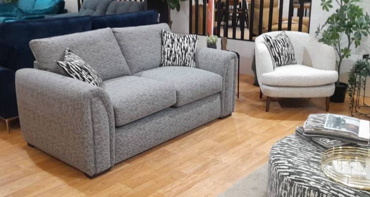 Sofa pictured with accent chair 