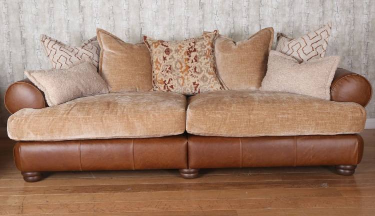 Grand pillow back sofa in Lazio brown leather / caramel rust fabric combination.