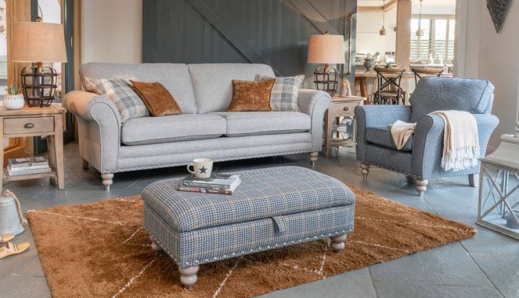 Grand sofa in fabric 1769, large scatter cushions in 2507, small scatter cushions in 2743, grey ash/brushed nickel legs. Accent chair in fabric 2557, grey ash/brushed nickel legs. Legged ottoman in fabric 2487, grey ash/brushed nickel legs. All items show