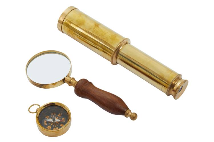 Brass compass, acacia wood magnifying glass and brass telescope.