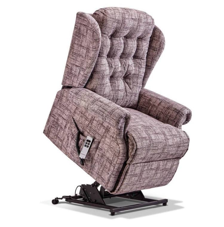 Lynton Royal Riser Recliner chair shown in Chedworth Damson fabric 